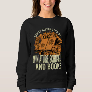 Easily Distracted By Miniature Schnauzer And Books Sweatshirt