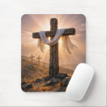 Easter Crosses On a Hill Mouse Pad<br><div class="desc">A central wooden cross,  covered with a white cloth and illuminated by the warm glow of the setting sun,  stands out against two additional crosses on a rocky hillside in the background</div>