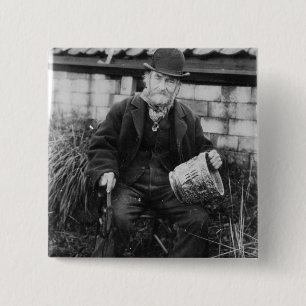 Edward Bingham holding one of his Castle 15 Cm Square Badge