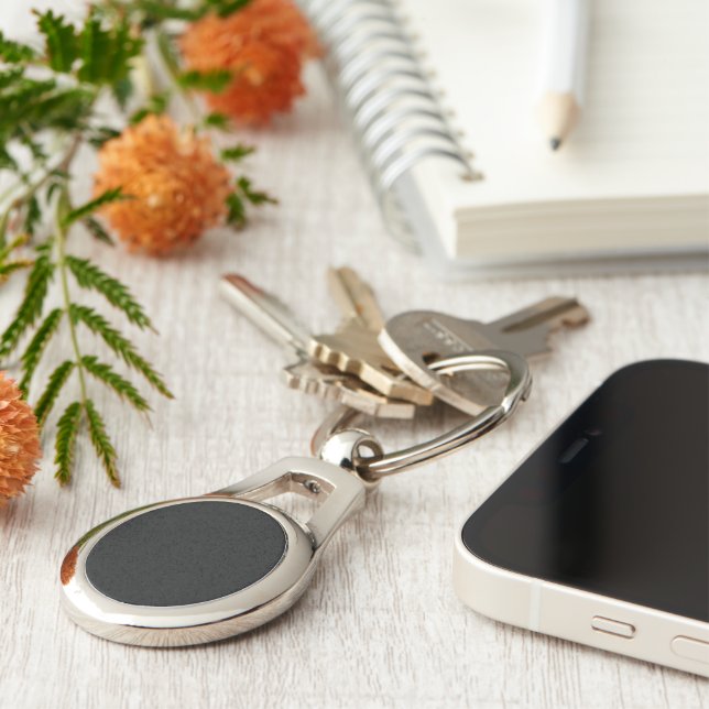 Eerie Black Oval Metal Keychain (Side)