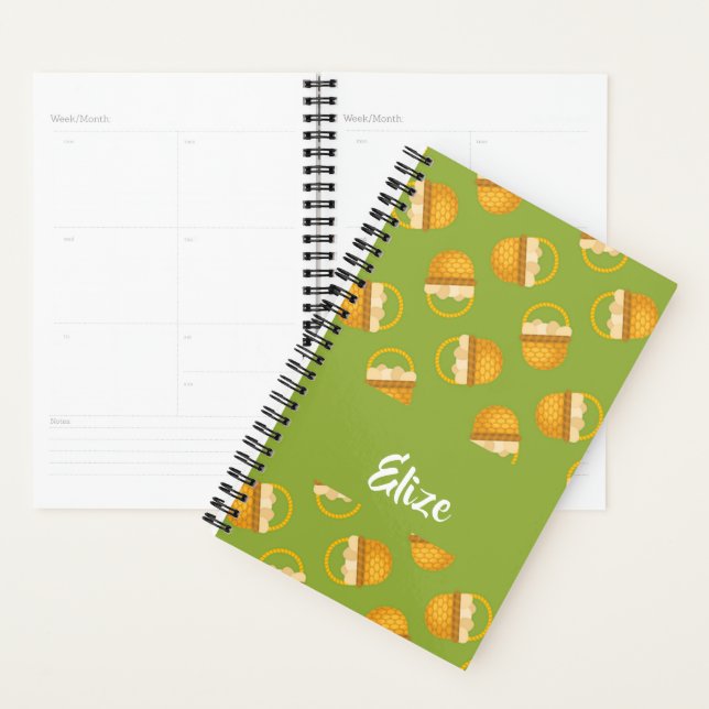 Eggs in brown basket on green planner (Display)