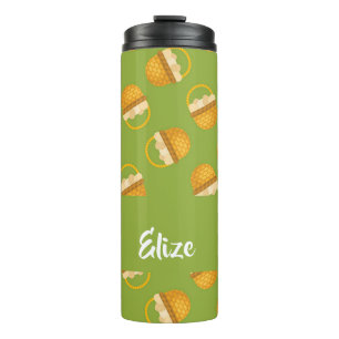 Eggs in brown basket on green thermal tumbler