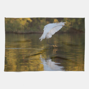 Egret in flight over Golden Pond Tea Towel