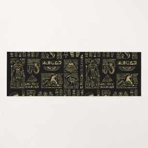Egyptian hieroglyphs and deities gold on black yoga mat