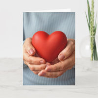 Elderly Woman Holding a Red Heart