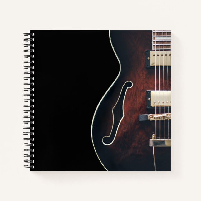 Electric Guitar On Black Notebook (Front)