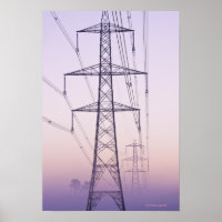 Electricity pylons in mist at dawn.