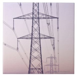 Electricity pylons in mist at dawn. tile