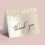Elegant 70th Birthday Party Gold Glitter Thank You Card<br><div class="desc">Chic 70th birthday party folded thank you card featuring "Thank You" in elegant calligraphy,  a gold faux foil background and gold faux glitter. Personalise your thank you message and signature on the inside,  or leave blank for a handwritten note.</div>