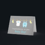 Elegant and Cute Baby Boy Clothes Card<br><div class="desc">Send your congratulations and well wishes to the new parents of a newborn baby boy with these mini baby clothes and accessories greeting card! This modern design in pastel colours includes cute baby items like yellow baby socks, a white baby jumpsuit with a bow tie and a pastel blue overalls...</div>