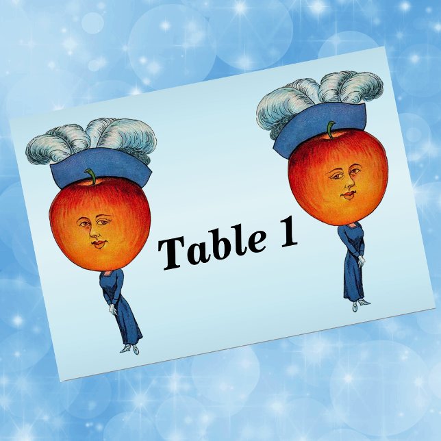 Elegant Apple Head Lady Feather Hat Table Number (Elegant Lady red Apple head with face fancy blue feather hat on light blue event table number cards.)