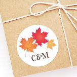 Elegant Autumn Leaves Wedding Monogram Classic Round Sticker<br><div class="desc">Fall themed wedding favor stickers feature maple leaves above customizable monogram of the bride and groom's initials. Rich autumn colors include orange,  red,  copper,  gold,  and chocolate brown.  Ivory / ecru background.</div>