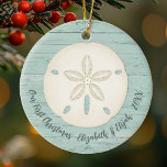 Elegant Beach Sand Dollar Photo First Christmas Ceramic Tree Decoration<br><div class="desc">A joyful Christmas ornament with a sand dollar and a weathered wood background for your 1st Christmas Celebration. Great for newlyweds. Put a beach honeymoon photo on the back. Personalise the front with your names and the year. Designed for you by Blackberry Boulevard.</div>