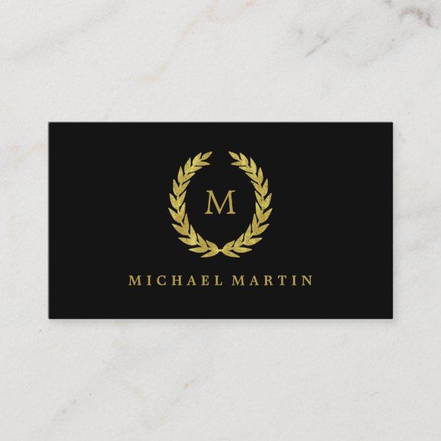 Elegant Black and Gold Laurel Wreath with Monogram Business Card (Front)
