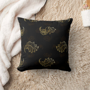 Elegant black background with intricate gold leaf  cushion