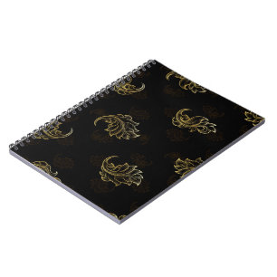 Elegant black background with intricate gold leaf notebook