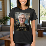 Elegant Black & Gold 70th Birthday Party Photo T-Shirt<br><div class="desc">Celebrate 70 in style with this elegant black and gold birthday photo T-shirt. Featuring your custom photo and chic gold script “Cheers to 70 Years”, this shirt is perfect for the guest of honour or for matching outfits with family and friends. The bold black backdrop and metallic-style gold lettering create...</div>