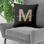 Elegant Black Gold Initial Name Monogram Cushion<br><div class="desc">Personalised Black and Gold Initial Name Monogram Throw Pillow. This chic monogram pillow merges modern minimalist style with a sophisticated edge, making it a versatile accent for any room. It features a bold, flat gold initial in a warm brown hue (no foil or shimmer) on a sleek black background, complemented...</div>