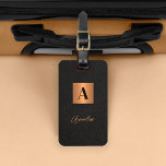 Elegant black gold monogram and name script  luggage tag<br><div class="desc">Luxury elegant modern monogram and signature script name personalised luggage tag featuring a faux metallic gold copper square with name initial over a black leather like (PRINTED TEXTURE) background.              Could be a stylish birthday,  wedding,  Christmas,  or any other occasion or anniversary gift.</div>