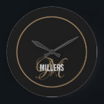 Elegant black gold monogram family name  large clock<br><div class="desc">Modern wall clock with a black background,  a gold script monogram and white family name. Personalise with your initial and family name.</div>