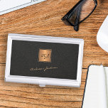 Elegant black gold monogrammed script name business card holder<br><div class="desc">Trendy luxury exclusive looking monogrammed gold business card case featuring a faux gold square over a stylish classy black leather look (printed) background.             Personalise it with your white script signature name and monogram name initials.</div>