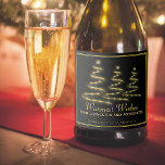 Elegant Black & Gold Stylised Christmas Trees Sparkling Wine Label<br><div class="desc">These sparkling wine bottle labels are perfect for a Christmas gift, holiday party or other festive occasion. The design features three stylised Christmas trees fashioned to look as if they are made from gold ribbon and stars. The caption reads: Warmest Wishes, with space for your name and the type of...</div>