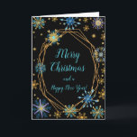 Elegant Blue and Gold Snowflakes Merry Christmas Holiday Card<br><div class="desc">A beautiful Christmas card design featuring elegant turquoise blue and gold snowflakes on a black background. Inside there is a space for a message. A perfect way to greet your friends and relatives in this festive season. The background colour of the inside and the text can be changed to suit...</div>