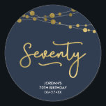 Elegant Blue Strings of Lights 70th Birthday Classic Round Sticker<br><div class="desc">This elegant 70th birthday round sticker feature strings of lights and the word "Seventy" in faux gold against a dark blue background. Check out other matching items here https://www.zazzle.com/collections/strings_of_lights_faux_gold_celebration_collection-119311942951401241?rf=238364477188679314 Personalise it with your details by replacing the placeholder text. For more options click the "Customise" button. *Please note that the Zazzle...</div>