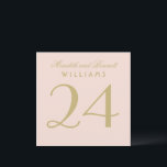 Elegant Blush Gold Wedding Table Number Card<br><div class="desc">Warm gold calligraphy and the couple's names on a soft blush background create a romantic, refined wedding table number card. The elegant script and classic serif typography bring timeless sophistication to your reception tables. The couple's names, surname, and table number are easy to personalise. Each table number must be individually...</div>