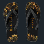 Elegant Bride Tribe Black & Gold Foliage Pattern Jandals<br><div class="desc">These elegant bride tribe black and gold foliage pattern flip flops boasts a luxurious black and gold palette, with a stunning golden floral pattern and modern typography set against a black background, exuding elegance and sophistication. It's a beautiful gift for your bridal tribe. View the collection on this page to...</div>