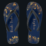 Elegant Bride Tribe Gold Foliage Navy Blue Jandals<br><div class="desc">These elegant bride tribe gold foliage pattern navy blue flip flops have a dark blue background that is adorned with an intricate gold floral greenery pattern and customisable modern typography. The combination of the rich navy and the shimmering gold create an elegant and luxurious aesthetic. It's a beautiful gift for...</div>