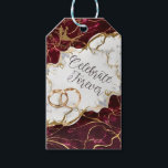 Elegant Burgundy & Gold Marble Wedding Invitation Gift Tags<br><div class="desc">Celebrate your eternal love with this exquisite design featuring a rich burgundy and white marble texture, accentuated by faux gold foil veins. The design showcases a romantic silhouette of a bride and groom within a floral heart, paired with interlocking wedding rings. Perfect for weddings, anniversaries, or engagement parties looking for...</div>