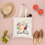 Elegant Burgundy Pink Floral Bridesmaid Name Tote Bag<br><div class="desc">A stunning watercolor bouquet of burgundy, pink, and blush blooms with deep greenery sits beneath a personalized name in clean block lettering and the bridal party role below. A vibrant and romantic design perfect for wedding attendants that doubles as a gorgeous everyday carry. Name and role are fully customizable.</div>