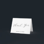 Elegant Classic Black and White Wedding Thank You Card<br><div class="desc">Capture the timeless beauty of love with this elegant black and white wedding photo, featuring intricate calligraphy. Perfect for couples seeking a sophisticated and classic touch for their special day, this beautiful image is ideal for wedding invitations, decor, or personal keepsakes. The contrast of black and white enhances the romantic...</div>