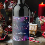 Elegant Deep Blue Pink Winter Wonderland Christmas Wine Label<br><div class="desc">Add a touch of elegance and festive spirit to your holiday celebrations with our customisable Christmas wine bottle label. Set against a mesmerising backdrop of deep blue and purple hues, the label is adorned with whimsical snowflakes and stars, creating a festive atmosphere. The words "Merry Christmas" are elegantly scripted in...</div>