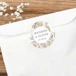 Elegant Earthy Floral White Wedding Favour Classic Round Sticker<br><div class="desc">This lovely favour sticker design features beautiful neutral colour florals with your names and wedding date. This timeless design is an excellent choice for many styles of events, from classic to boho. Customised favour labels make a wonderful addition to your wedding reception or bridal shower decor... and adds that extra...</div>
