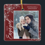 Elegant Engaged Christmas Snowflakes Red Ceramic Ornament<br><div class="desc">This red square Christmas ornament is a perfect gift for the newly engage couple. The design features a photo frame with handwritten text "Engaged" and is accented with light grey snowflakes on a red background. Personalise with a pictures of the couple,  their names and year.</div>