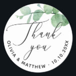 Elegant Eucalyptus Wedding Thank You | Greenery Classic Round Sticker<br><div class="desc">Add a refined touch to your wedding favours, gift bags, or envelopes with this personalised wedding thank you sticker. Featuring watercolor eucalyptus greenery and elegant calligraphy, it brings a fresh and natural look to your celebration. Customise with your names and wedding date to create a thoughtful detail that ties your...</div>