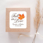 Elegant Fall in Love Autumn Wedding Monogram Square Sticker<br><div class="desc">"Fall in Love" themed wedding favour stickers feature an orange maple leaf and chocolate brown customisable monogram of the bride and groom's names and wedding date.</div>