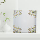 Elegant Fancy Gold Ornate Baroque Filigree Border  Tile<br><div class="desc">An exquisite decorative ceramic tile, exuding elegance through a captivating design. A sophisticated faux gold border gracefully adorns the periphery, delicately accentuated by mesmerising turquoise gems. Set against a lustrous silver metallic backdrop, this tile exudes timeless allure, making it a perfect addition to your decor. Embrace the opulence and charm...</div>