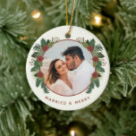 Elegant Floral 2 Photo Married First Christmas Ceramic Tree Decoration<br><div class="desc">Celebrate your first Christmas together and create a treasured keepsake with this beautiful photo ornament! It features hand drawn winter greenery and flowers in rustic colours of brick red and various shades of green over an ivory background. Easy to customise, with photo and text templates on both the back and...</div>