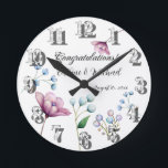 Elegant Floral Wedding Soft Botanical Romance Round Clock<br><div class="desc">This elegant design features a graceful arrangement of hand-painted floral elements in soft, pastel tones. The design showcases delicate white buds, gentle blue blossoms, and a vibrant magnolia flower, all set against a soft grey background. The minimalist floral accents evoke a sense of timeless beauty and romance, perfect for couples...</div>