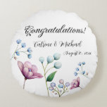 Elegant Floral Wedding Soft Botanical Romance Round Cushion<br><div class="desc">This elegant design features a graceful arrangement of hand-painted floral elements in soft, pastel tones. The design showcases delicate white buds, gentle blue blossoms, and a vibrant magnolia flower, all set against a soft grey background. The minimalist floral accents evoke a sense of timeless beauty and romance, perfect for couples...</div>