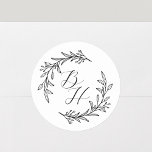 Elegant Floral Wreath Monogram Wedding  Classic Round Sticker<br><div class="desc">Custom-designed wedding monogram stickers featuring modern calligraphy with hand-drawn style floral wreath design. Perfect for adding a touch of style to wedding envelopes,  gift packagings,  and more.</div>
