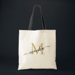 Elegant Gold and Black Personalised Monogram Tote Bag<br><div class="desc">Classic girly minimalist and elegant tote bag. this design features a simple and modern gold and black script monogram. You can personalise with an initial and name in script. This tote bag will be perfect personalised gift for wedding party - maid of honour, bridesmaids, mothers of the bride and groom,...</div>
