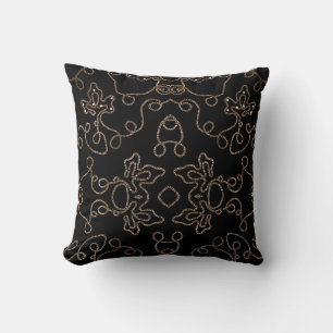 Elegant gold embellishments on black cushion