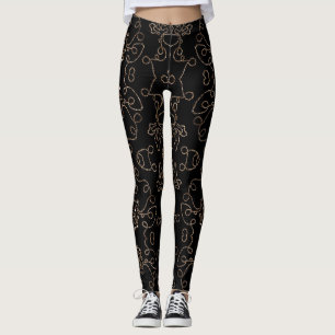 Elegant gold embellishments on black Leggings