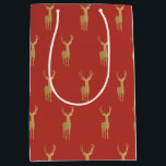 elegant gold reindeer red merry christmas pattern medium gift bag<br><div class="desc">elegant gold reindeer red merry christmas pattern</div>