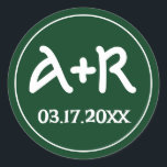 Elegant initials celtic font green wedding classic round sticker<br><div class="desc">This round envelope seal sticker features a beautiful shade of green, adding a touch of elegance to any wedding invitation. The initials of the couple are elegantly displayed in a stunning Celtic font, giving it a unique and personalised touch. This sticker is the perfect addition to a St. Patrick's Day...</div>