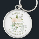 Elegant Ivory Peach Roses Bridesmaid Wedding Keych Key Ring<br><div class="desc">These keychains are designed to give as favours to bridesmaids in your wedding party. They feature a beautiful hand painted watercolor design with a bouquet of ivory peach coloured roses, eucalyptus leaves and greenery, with a white banner across the centre reading: Bridesmaid in elegant moss green script lettering. There is...</div>